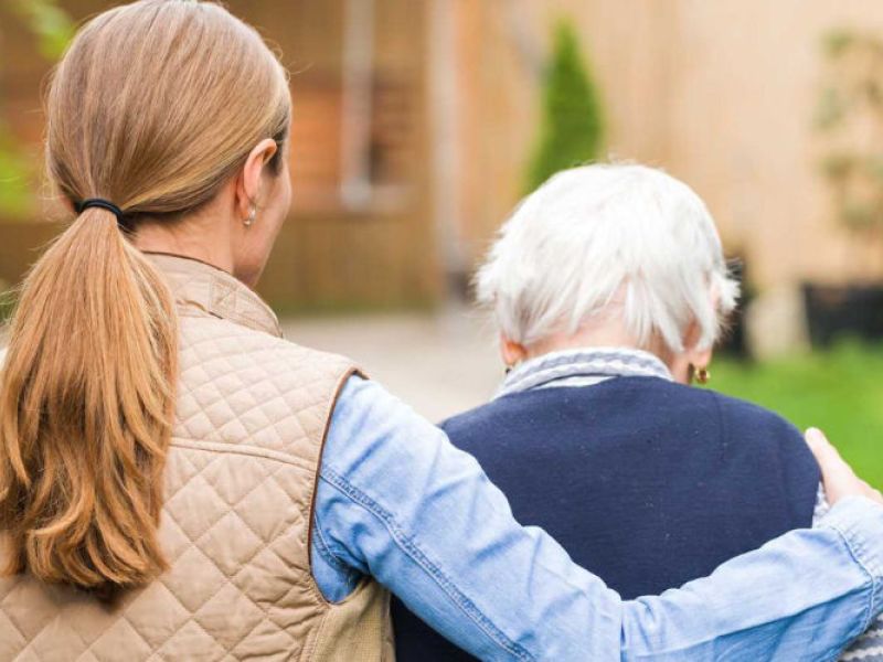 A caregiver walking senior.