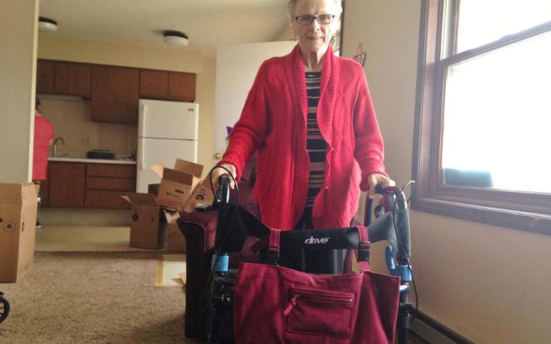 Woman holding wheelchair