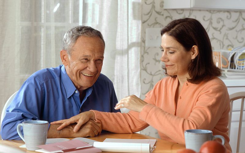 elderly couple at table