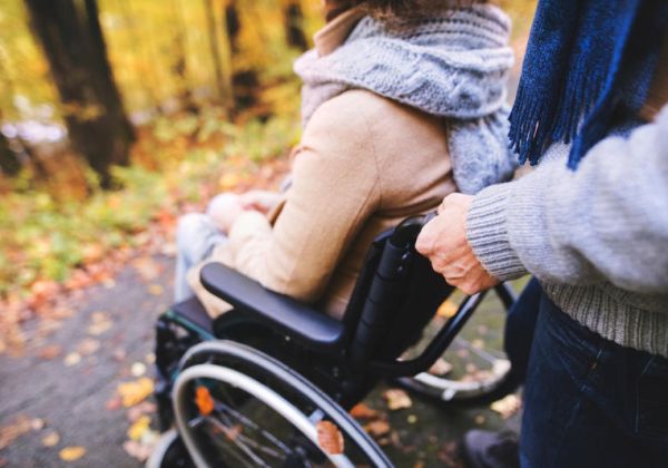 Woman in wheelchair outside