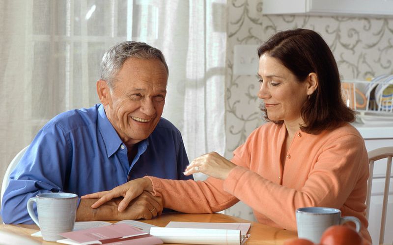 elderly couple at table